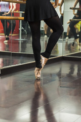 Fototapeta na wymiar Ballerina dancing, closeup on legs and shoes.