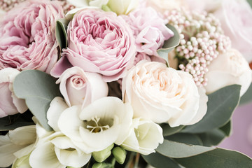 Wedding bouquet of roses and peonies. Bridal bouquet on wedding day. Different flowers of pink, violet and white blossoms