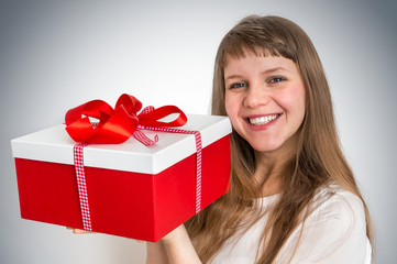 Pretty smiling woman with red gift box
