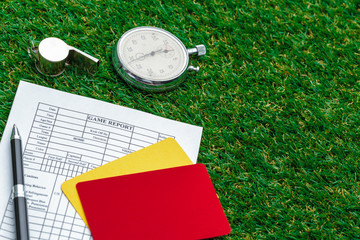 two penalty cards and a whistle for the referee