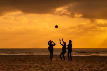Kids playing with ball on the beach - 210647062