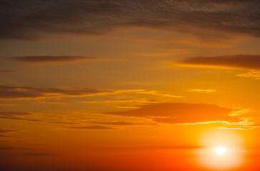 Fototapeta na wymiar Beautiful fiery orange sunset sky as background