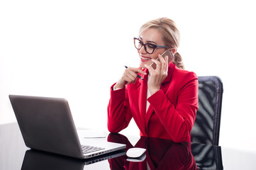 Attractive businesswoman using smartphone in office on white background