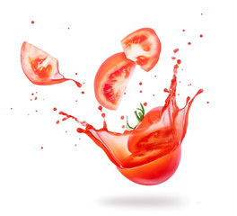 Sliced tomato with flowing juice close-up on white background