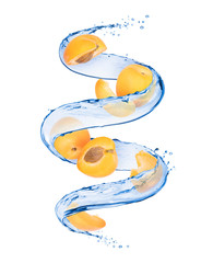Slices of apricots with splashes of water in a swirling shape