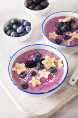 healthy berry smoothie bowl with banana and sesame seed