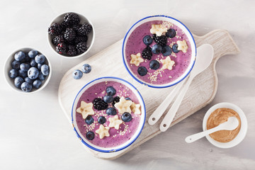 healthy berry smoothie bowl with banana and sesame seed