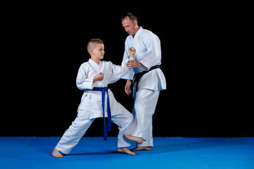 Male karate instructor training little children in dojo © FS-Stock