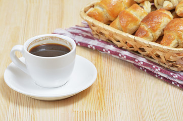 Freshened home croissants lie in a wicker basket