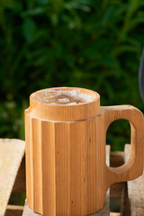 Naklejka premium beer in a wooden mug