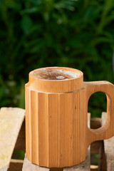 Naklejka premium beer in a wooden mug