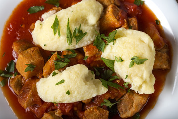 Traditional Hungarian food: Goulash with dumplings made from eggs, white flour and butter