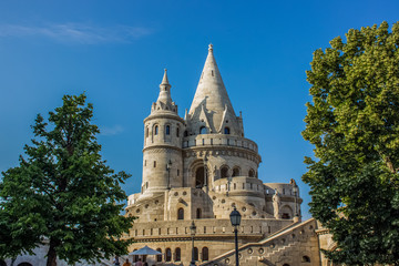 fairy tale white castle palace architecture building with towers on blue sky background between...