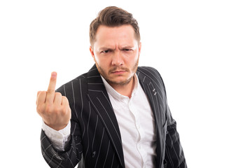 Portrait of angry business man showing middle finger.