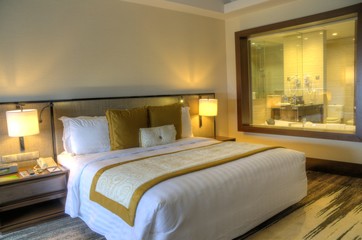 beautiful luxurious bedroom, condominium, apartment with double bed and pillow