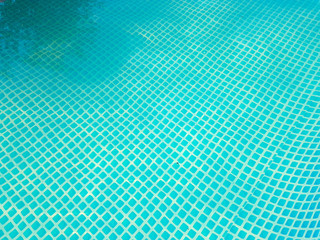 the bottom of the pool is blue mosaic