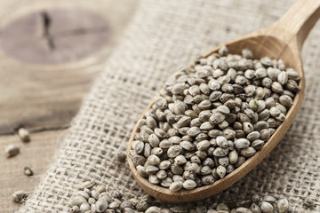 cannabis seeds in a wooden spoon