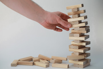 Board game jenga tower of wood sticks