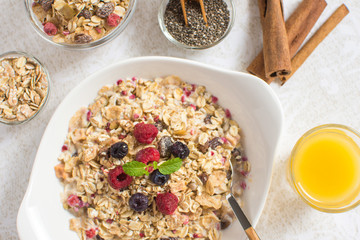 Muesli With Milk, Chia Seeds, Berries and Cinnamon as Healthy Breakfast