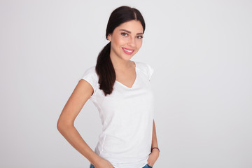 portrait of relaxed brunette woman in white t-shirt