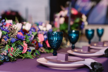 Beautiful wedding flowers. Floristics and candles for decoration of a wedding