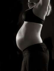 young woman with baby belly