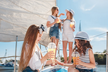 Obraz premium The children on board of sea yacht