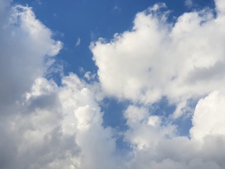 Beautiful nature of blue sky and clouds with the sun shining, sky background, cloudscape concept. Space for text in template, Empty, Looking up