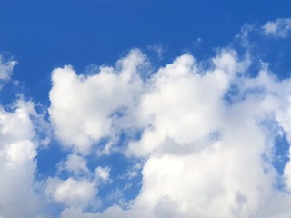 Beautiful nature of blue sky and clouds with the sun shining, sky background, cloudscape concept. Space for text in template, Empty, Looking up