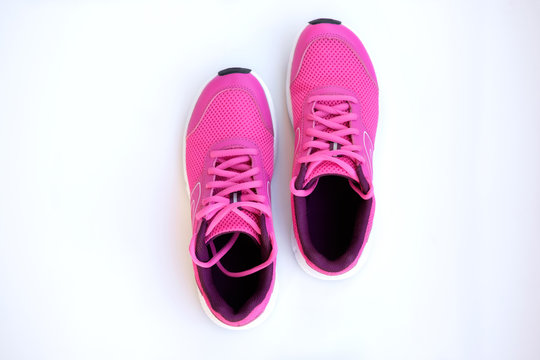 Pink Running Shoes For Women On A White Background