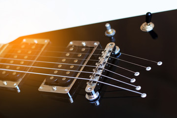 Fototapeta na wymiar Black arrowed electric guitar close up