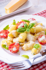 delicious gnocchi with gorgonzola cream sauce and cherry tomatoes
