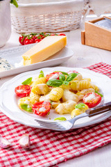 delicious gnocchi with gorgonzola cream sauce and cherry tomatoes