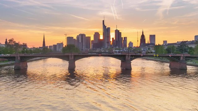frankfurt financial city center skyscrapers time lapse sunset to night from main river zoom in