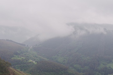 Mysterious mountain landscape with fog banks.