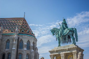 Budapest - capital of Hungary county side monument near  catholic church in summer time bright...