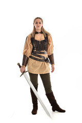 full length portrait of girl wearing brown medieval costume,. standing pose, isolated on white studio background.