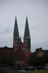 beautiful big church in lübeck with a scaffolding on a rainy day