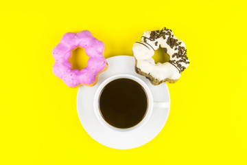 Donut made at home with White Coffee Cup of Espresso on yellow background.Breakfast in the morning rush hour.High energy foods to work.Foods with very high calories, sugars and caffeine
