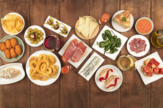 Spanish tapas food on dark background with place for text
