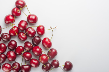 Sweet cherries on a white background with space for writing