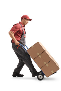 Mover with a hand truck loaded with cardboard boxes