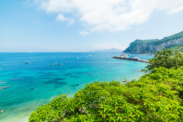 Fototapeta premium White clouds over Capri island coastline
