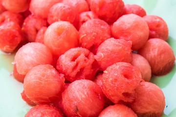 Watermelon carved into a sphere. To eat easily.