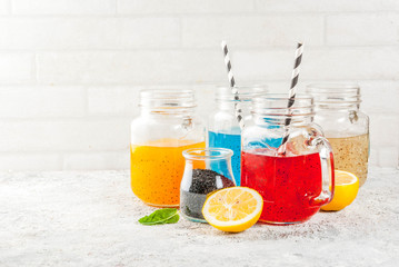 Set of different chia seed drink, tropical fruit cocktails,  fresca, grey stone background copy space