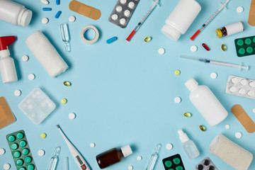 top view of frame made of different medicines on blue surface