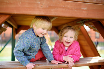Happy kids having fun on outdoor playground