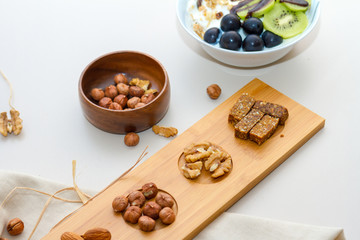 Nuts and Date Palm in Wooden Plate