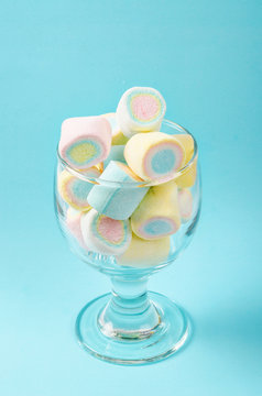 Colorful mini marshmallows in modern glass.