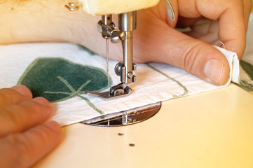 Seamstress sewing on a sewing machine                